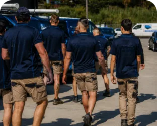 Plumbers walking to their service vans on a Hurlstone Park job