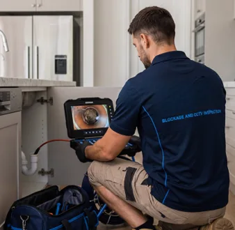 Clearing a blocked sink at a Hurlstone Park property